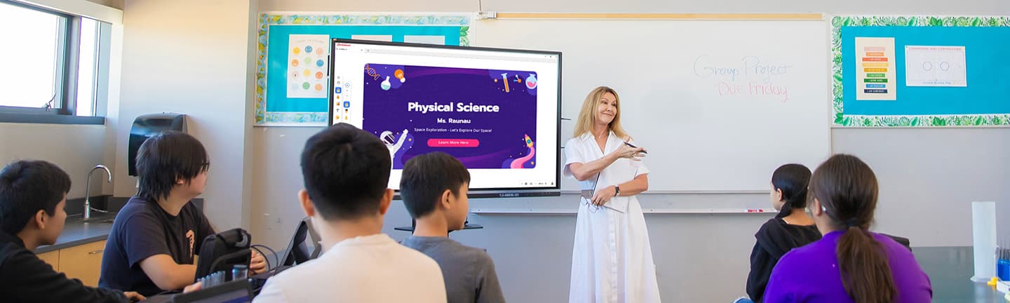 Teacher presenting a science lesson on a ViewSonic ViewBoard in a bright classroom